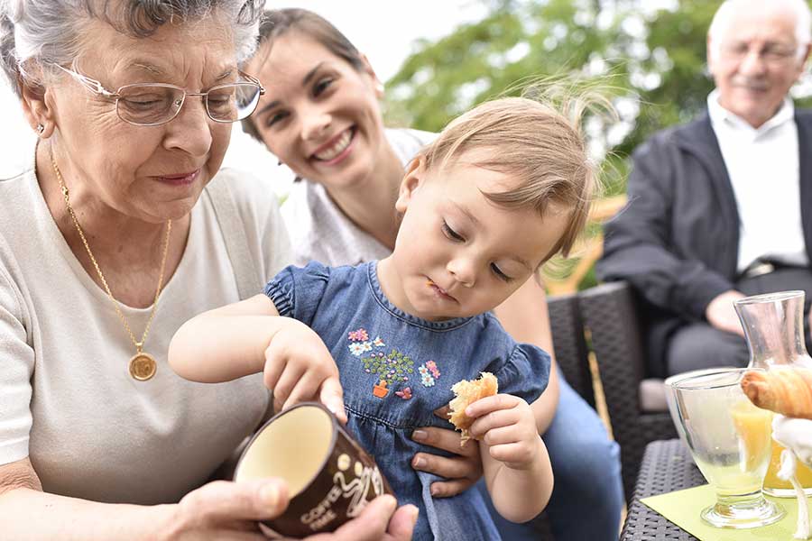 Happy extended family with grand daughters seniors have annuity death benefit
